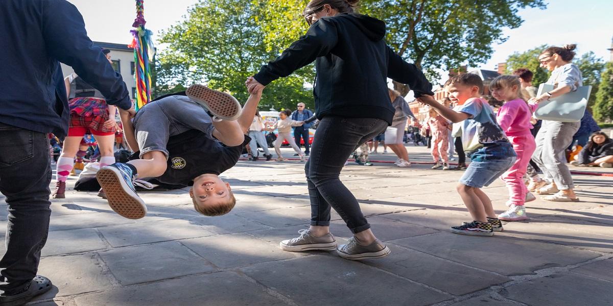 A boy in mid air whilst in a circle during Lancashire Encounter