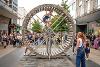 A look inside the wooden wheel where a performer is climbing in and out