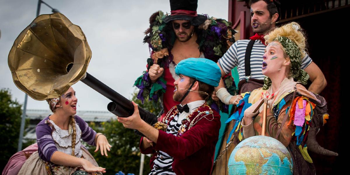 Actors in bohemian dress performing for Lancs Encouner on Preston Flag Market.