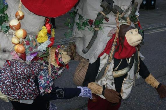 Two puppets walking around the Preston streets for Brief Encounter 2017.