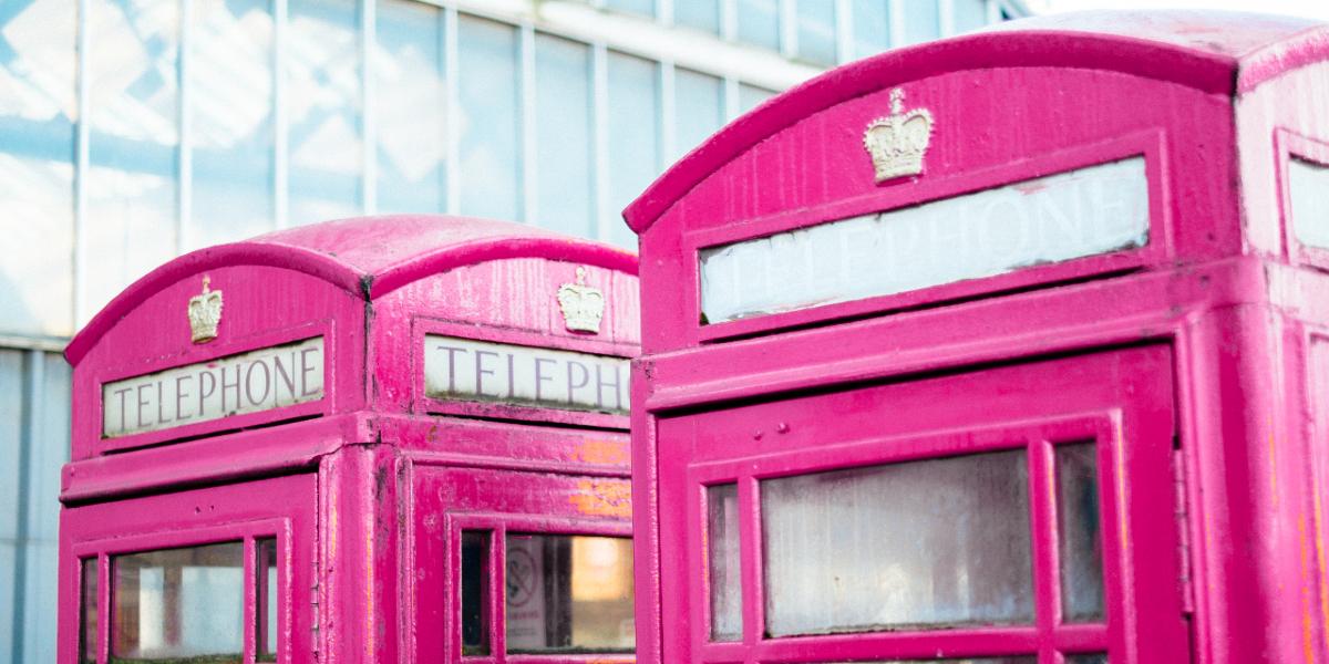 Preston red telephone boxes coloured in the Lancashire Encounter shade of pink.